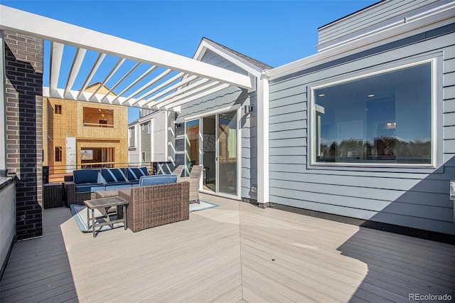 wooden terrace with outdoor lounge area and a pergola