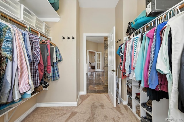 31200 E 145th Ave, Brighton, CO 80603 - walk in closet with carpet flooring and french doors