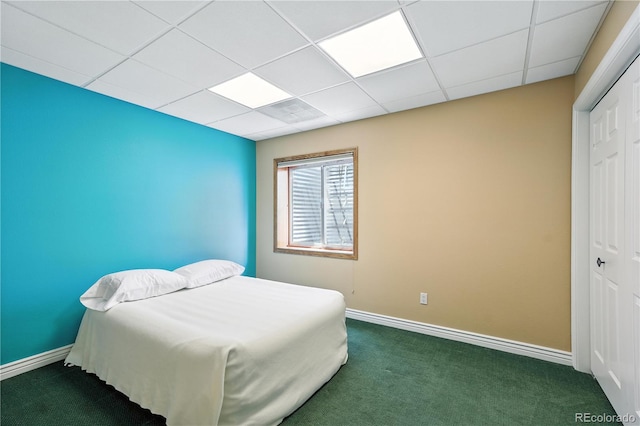 31200 E 145th Ave, Brighton, CO 80603 - bedroom featuring a closet, a drop ceiling, and dark carpet