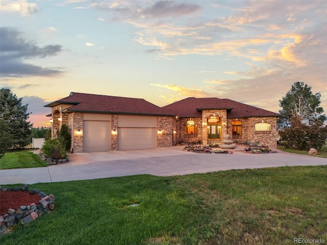 31200 E 145th Ave, Brighton, CO 80603 - view of front of home with a garage, a lawn, concrete driveway, and stone siding