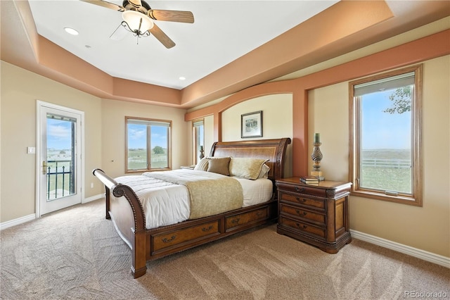 31200 E 145th Ave, Brighton, CO 80603 - bedroom with access to exterior, carpet flooring, a tray ceiling, ceiling fan, and recessed lighting
