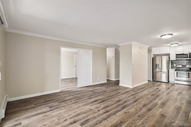 3460 S Poplar St Unit 404, Denver, CO 80224 - unfurnished living room featuring wood finished floors, baseboards, and crown molding