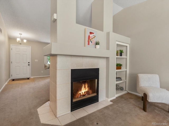 2548 Foothills Canyon Ct, Highlands Ranch, CO 80129 - living area featuring carpet flooring, a fireplace, a chandelier, and high vaulted ceiling