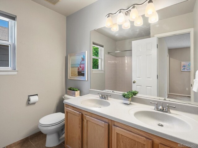 2548 Foothills Canyon Ct, Highlands Ranch, CO 80129 - full bath with a shower, double vanity, and tile patterned flooring