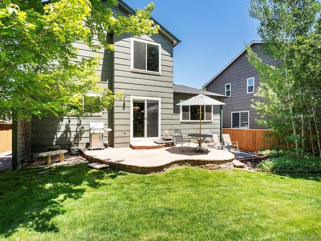 2548 Foothills Canyon Ct, Highlands Ranch, CO 80129 - rear view of property featuring a patio