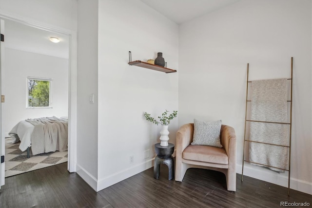 living area featuring dark wood finished floors and baseboards