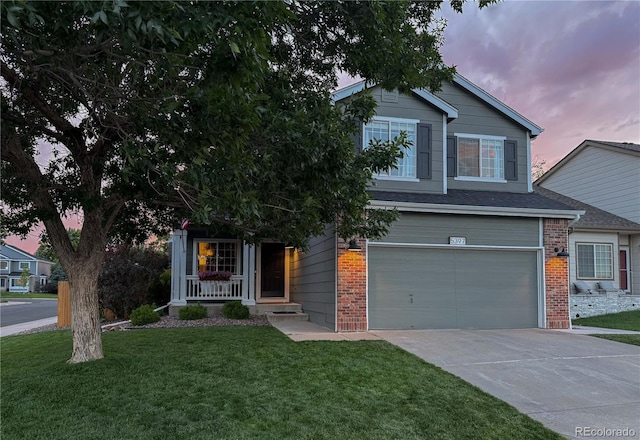 5397 S Killarney St, Centennial, CO 80015 - view of property hidden behind natural elements with a garage, brick siding, a yard, and driveway