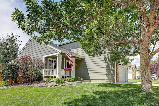 5397 S Killarney St, Centennial, CO 80015 - view of front facade featuring a front lawn, covered porch, and an attached garage