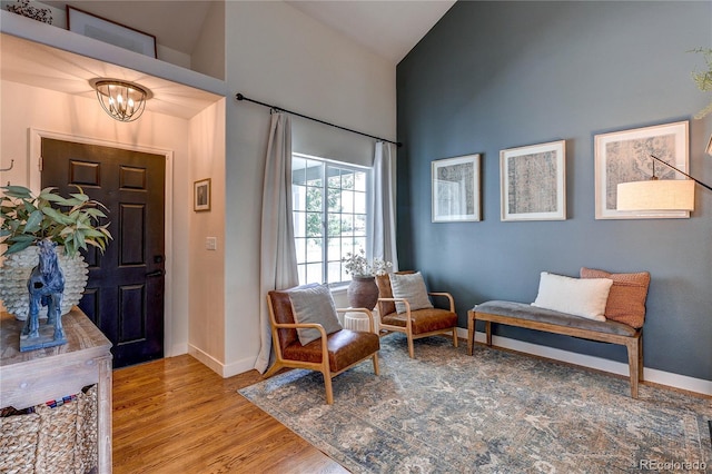 5397 S Killarney St, Centennial, CO 80015 - foyer entrance with a chandelier, high vaulted ceiling, and wood finished floors