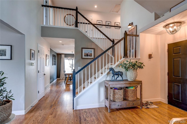 5397 S Killarney St, Centennial, CO 80015 - foyer entrance featuring a chandelier, wood finished floors, stairway, a towering ceiling, and recessed lighting