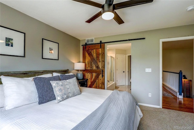 5397 S Killarney St, Centennial, CO 80015 - carpeted bedroom featuring a barn door and a ceiling fan