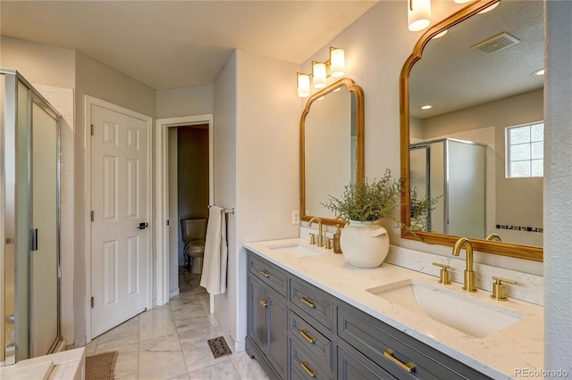 5397 S Killarney St, Centennial, CO 80015 - bathroom with marble look tile flooring, double vanity, and a shower stall