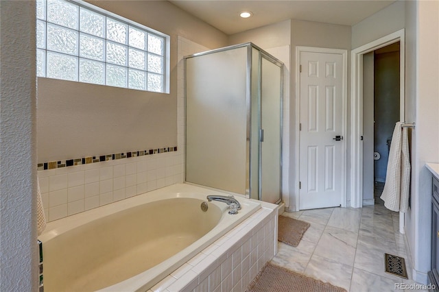 5397 S Killarney St, Centennial, CO 80015 - full bath featuring a bath, a stall shower, vanity, and recessed lighting
