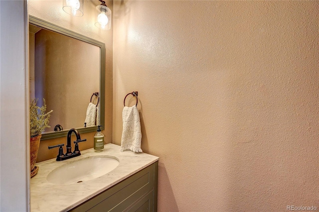 5397 S Killarney St, Centennial, CO 80015 - bathroom with vanity and a textured wall