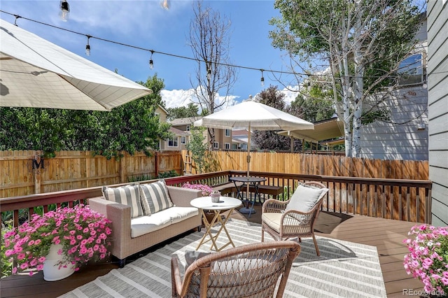 5397 S Killarney St, Centennial, CO 80015 - deck featuring a fenced backyard, outdoor lounge area, and outdoor dining area