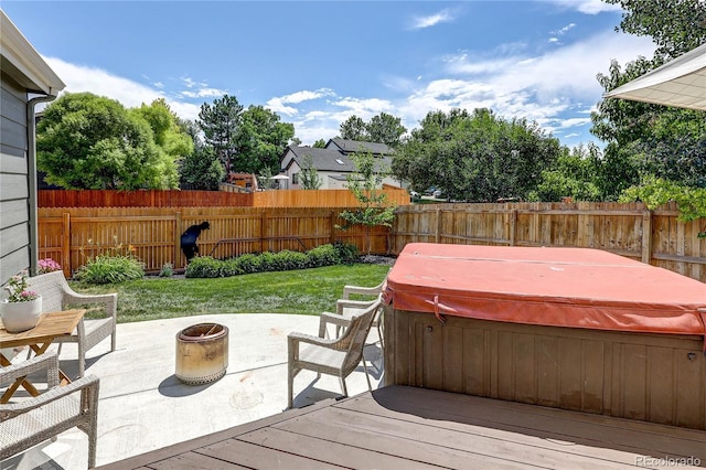 5397 S Killarney St, Centennial, CO 80015 - deck with a hot tub, a fenced backyard, a fire pit, and a patio