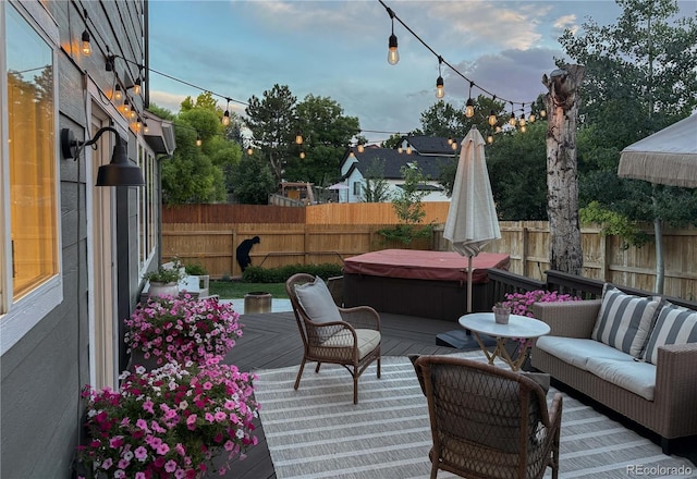 5397 S Killarney St, Centennial, CO 80015 - deck featuring a covered hot tub, a fenced backyard, and an outdoor living space