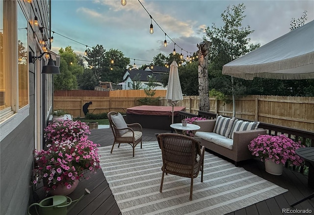 5397 S Killarney St, Centennial, CO 80015 - wooden deck featuring a hot tub, a fenced backyard, and an outdoor living space