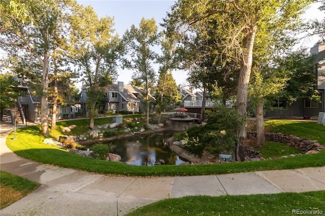 view of community featuring a water view