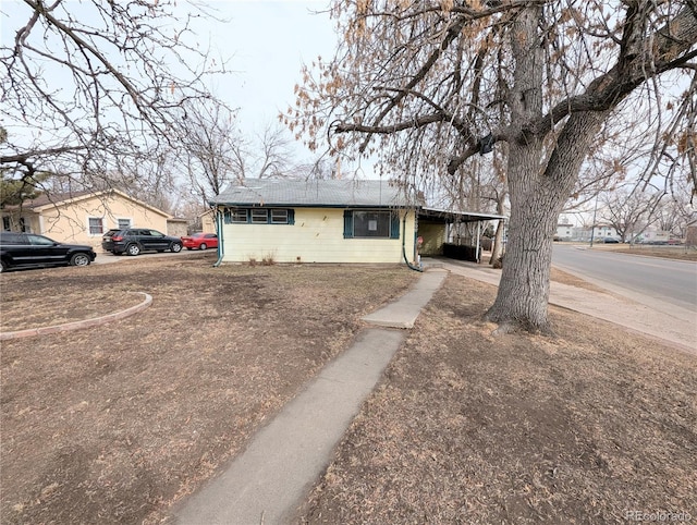 view of front of property with a carport