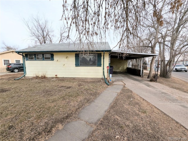 ranch-style home featuring a carport