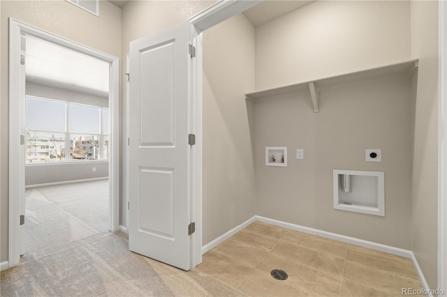 washroom featuring washer hookup, light carpet, and electric dryer hookup