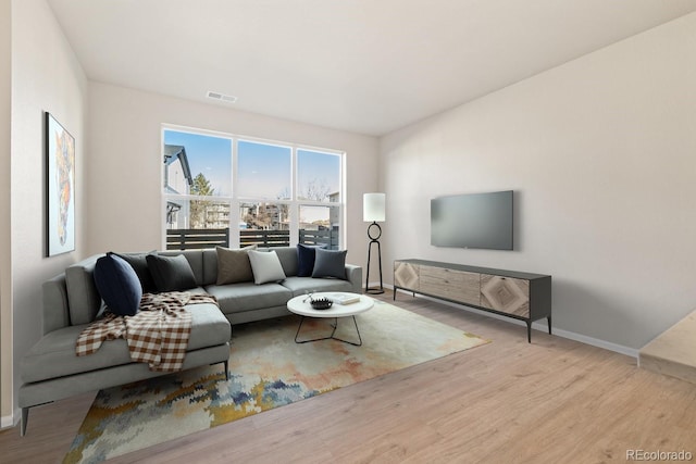 living room with light hardwood / wood-style floors