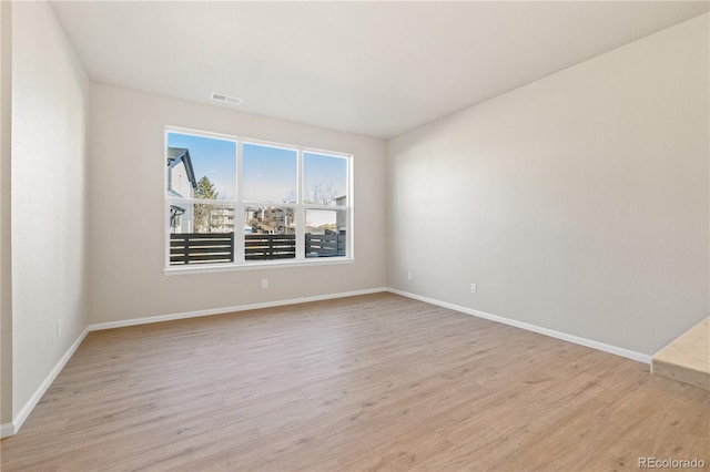 unfurnished room featuring light wood-type flooring