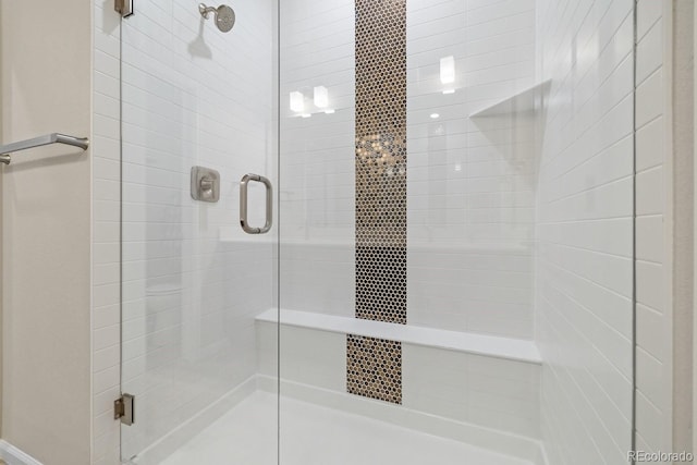 bathroom with a shower with shower door