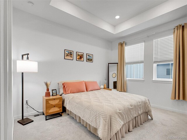 7488 W Pacific Ln, Denver, CO 80227 - bedroom featuring light colored carpet, a tray ceiling, and recessed lighting