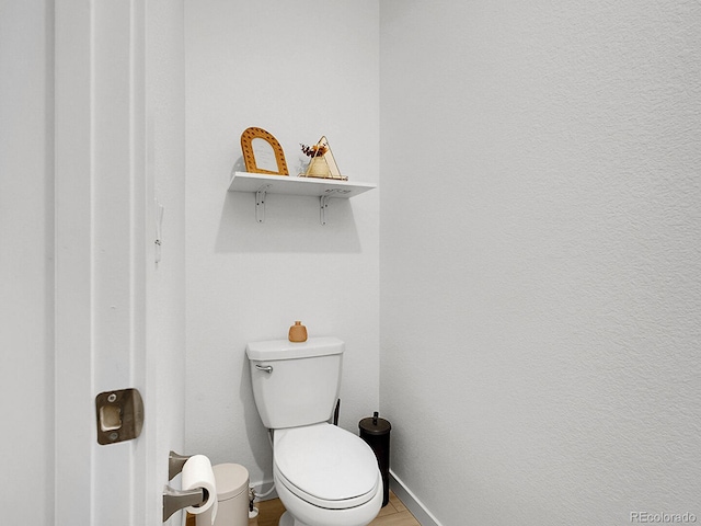 7488 W Pacific Ln, Denver, CO 80227 - bathroom featuring baseboards and wood finished floors