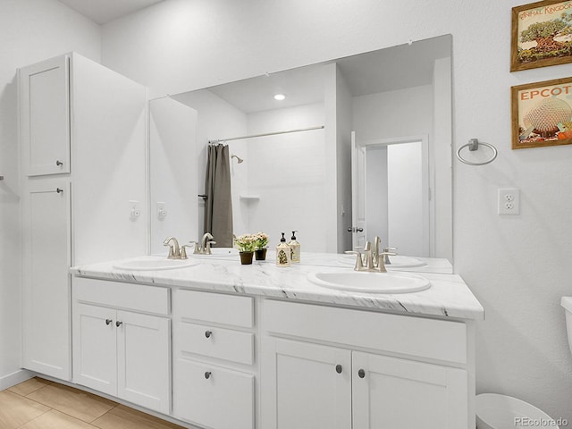 7488 W Pacific Ln, Denver, CO 80227 - full bathroom with double vanity, a shower with shower curtain, and tile patterned flooring