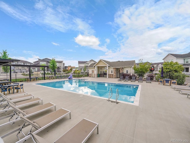 7488 W Pacific Ln, Denver, CO 80227 - community pool featuring a patio area and a residential view