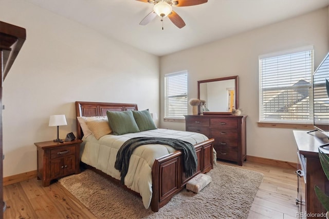 bedroom featuring light hardwood / wood-style flooring and ceiling fan