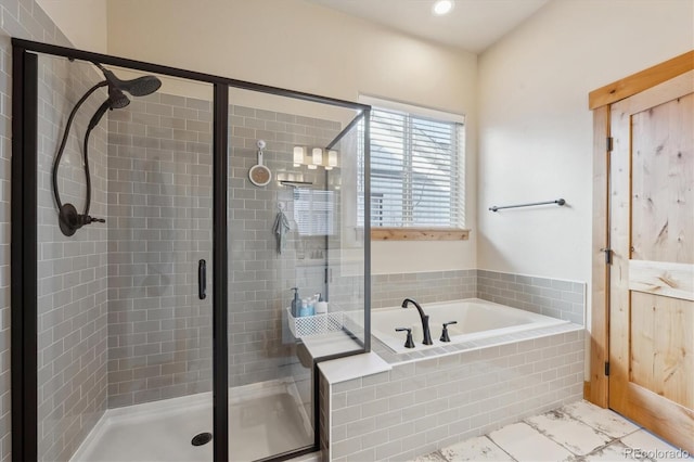 bathroom featuring shower with separate bathtub and tile patterned flooring