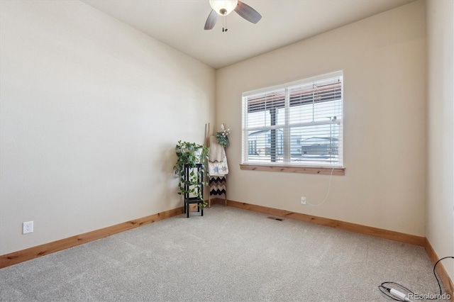 empty room with carpet floors and ceiling fan