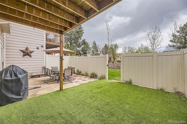 view of yard featuring a patio and fence