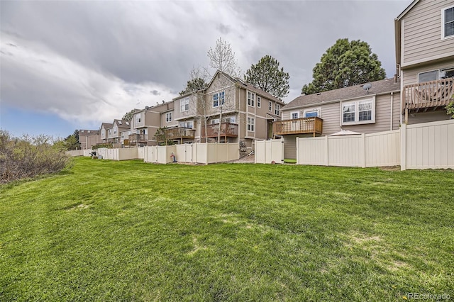 view of yard featuring a residential view and fence