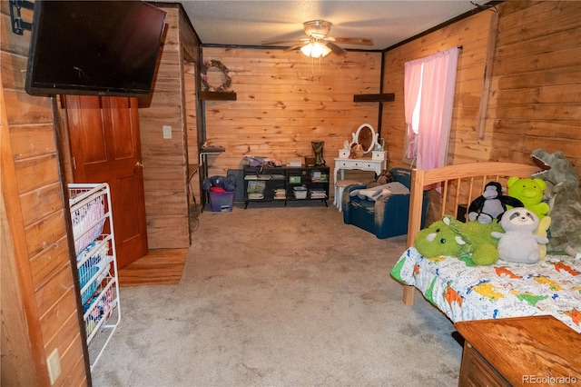 bedroom with light carpet, wooden walls, and ceiling fan