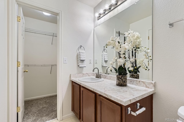 1998 Coach House Loop, Castle Rock, CO 80109 - bathroom featuring vanity and a walk in closet