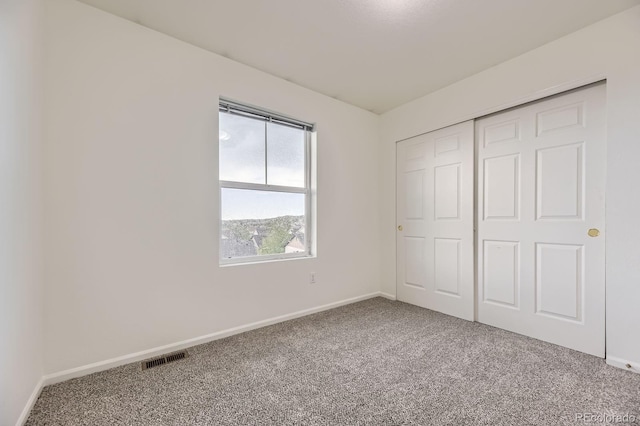1998 Coach House Loop, Castle Rock, CO 80109 - unfurnished bedroom with carpet flooring and a closet