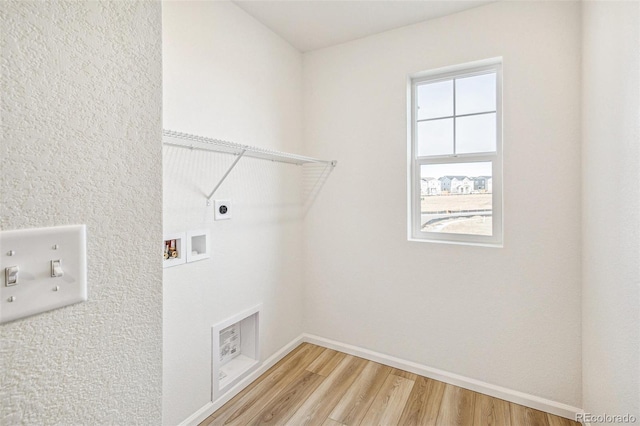 laundry room with hardwood / wood-style flooring, washer hookup, and hookup for an electric dryer