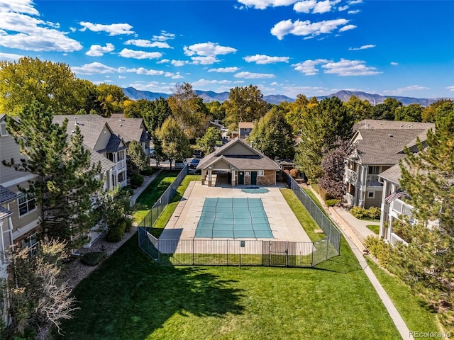 view of pool with a mountain view and a patio area