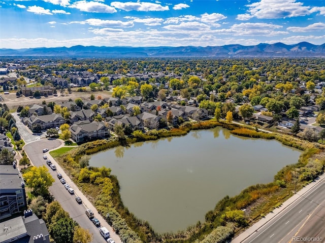 aerial view of residential area featuring a water and mountain view