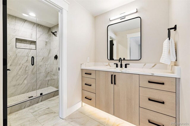 bathroom featuring vanity and a shower with door