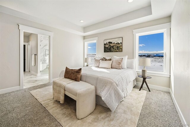 carpeted bedroom featuring multiple windows