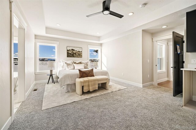 bedroom featuring light carpet and ceiling fan