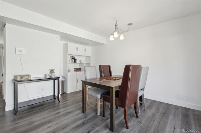 12455 W Alameda Dr, Lakewood, CO 80228 - dining room with dark wood-style flooring, a chandelier, and baseboards