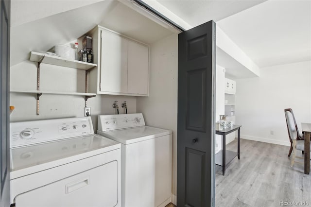 12455 W Alameda Dr, Lakewood, CO 80228 - laundry area with separate washer and dryer, light wood-type flooring, baseboards, and cabinet space