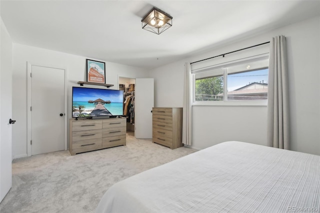 12455 W Alameda Dr, Lakewood, CO 80228 - bedroom featuring light carpet, a spacious closet, and a closet
